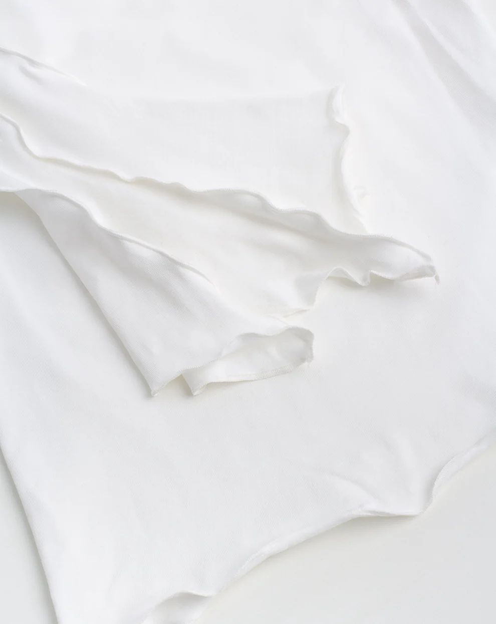 Лонгслів драпований білий